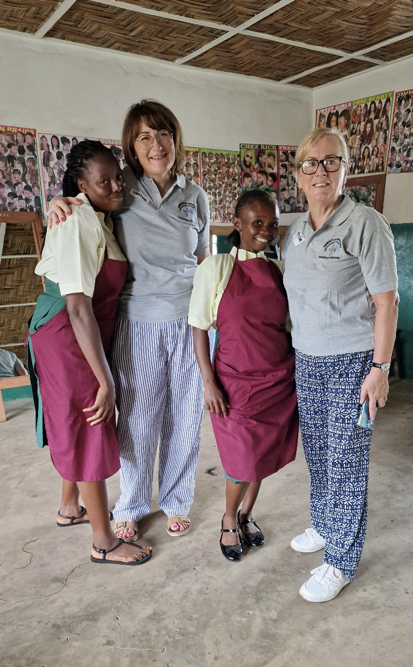 Ann Nichols and Roisin Maguire with beneficiaries of the Senan Kerrigan Vocational Skills Centre, Sierra Leone